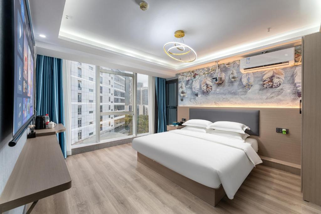 Postel nebo postele na pokoji v ubytování Lilang International Apartment-Guangzhou Pazhou Exhibition Center Branch