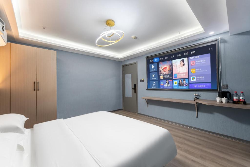 Postel nebo postele na pokoji v ubytování Lilang International Apartment-Guangzhou Pazhou Exhibition Center Branch