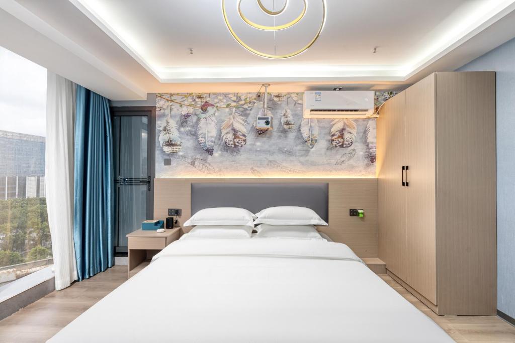 Postel nebo postele na pokoji v ubytování Lilang International Apartment-Guangzhou Pazhou Exhibition Center Branch