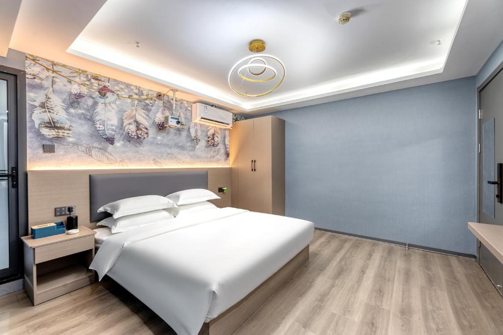 Postel nebo postele na pokoji v ubytování Lilang International Apartment-Guangzhou Pazhou Exhibition Center Branch