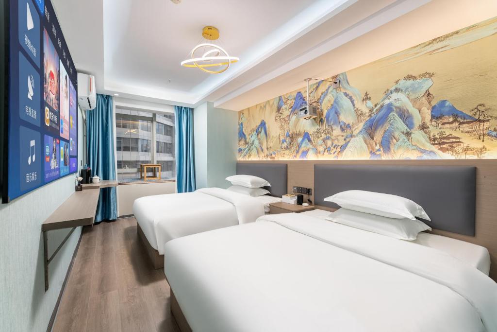 Postel nebo postele na pokoji v ubytování Lilang International Apartment-Guangzhou Pazhou Exhibition Center Branch