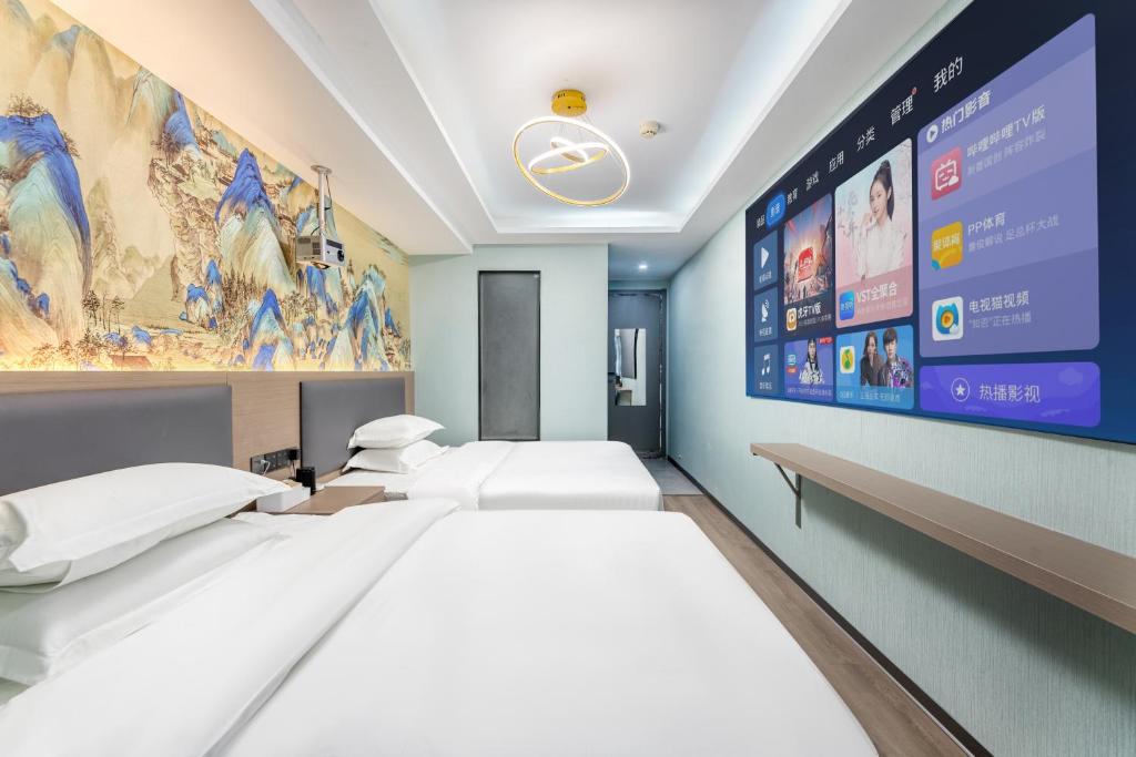 Postel nebo postele na pokoji v ubytování Lilang International Apartment-Guangzhou Pazhou Exhibition Center Branch