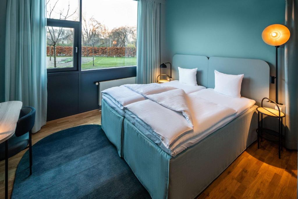 Postel nebo postele na pokoji v ubytování Scandic Sydhavnen