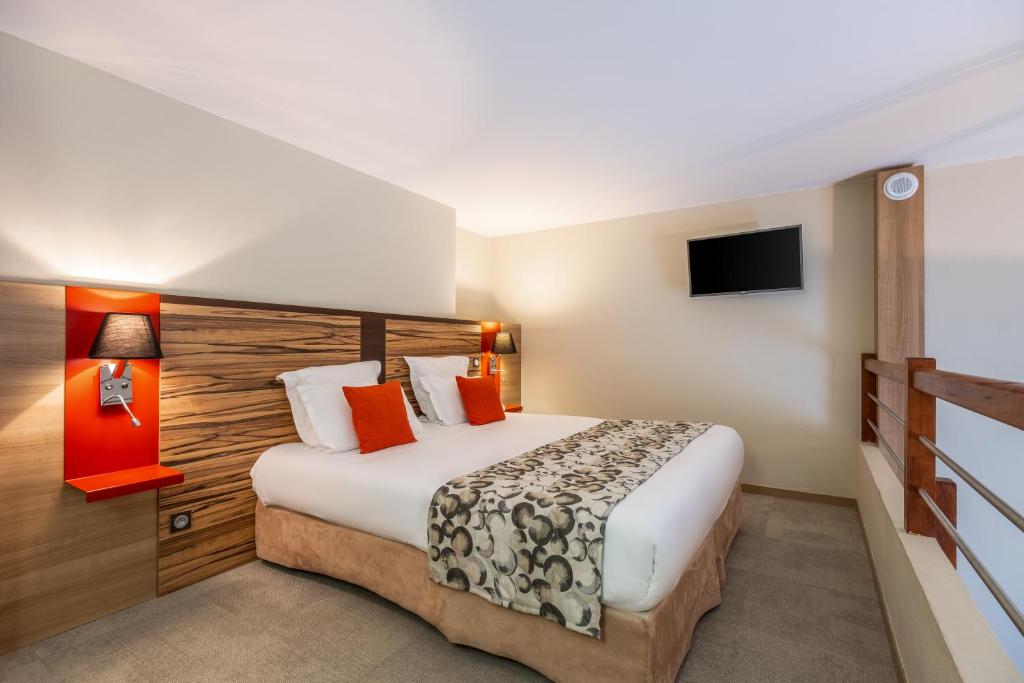 Postel nebo postele na pokoji v ubytování Aparthotel Adagio Lyon Patio Confluence