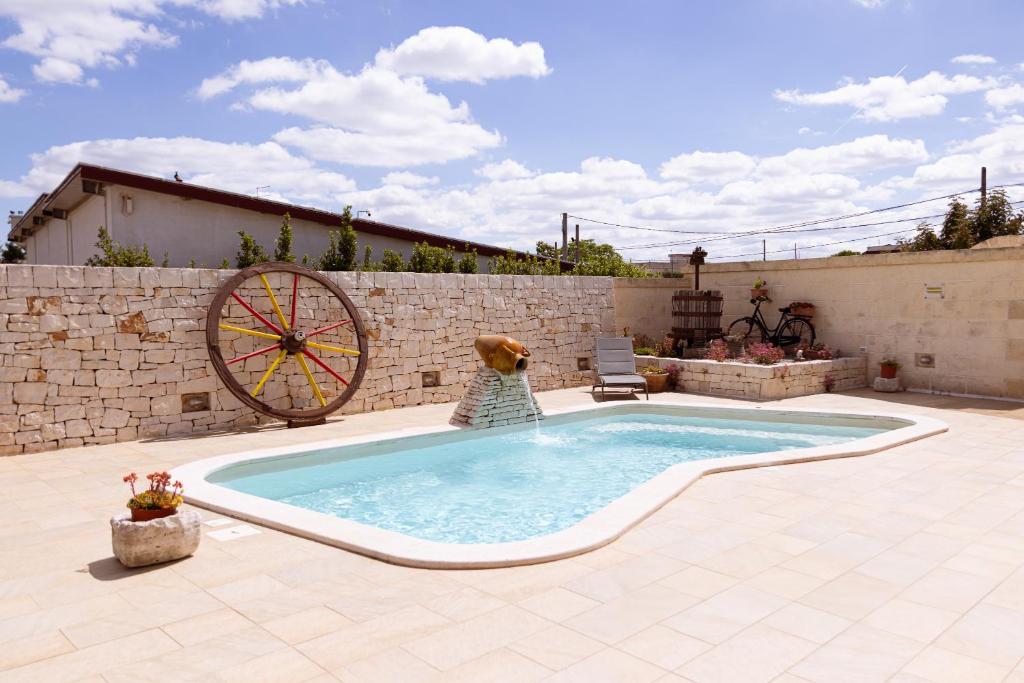The swimming pool at or close to Quei Trulli Divini