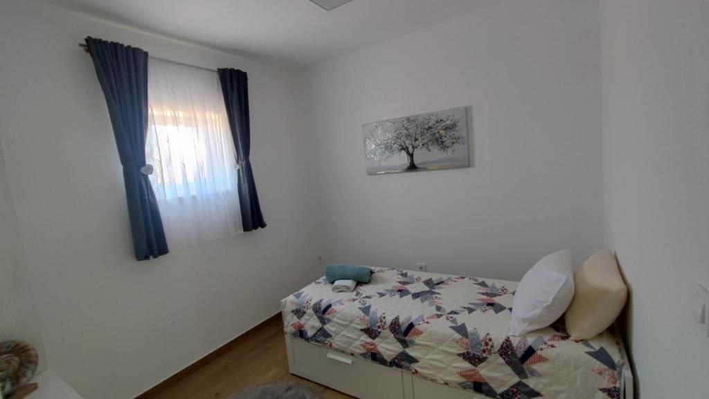Ένα ή περισσότερα κρεβάτια σε δωμάτιο στο Apartman Solis - Family