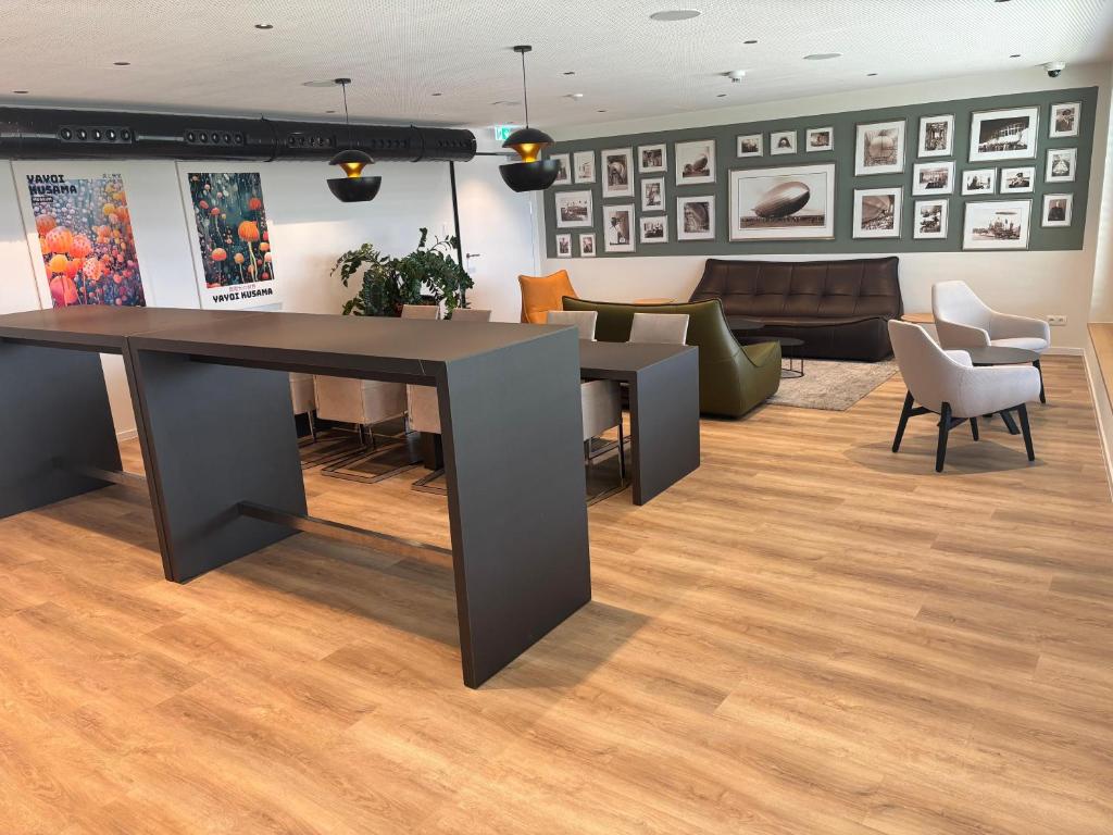 Posezení v ubytování My Flats Studio Apartements - klimatisiert durch Tiefengeothermie - nahe Ravensburger Spieleland und Friedrichshafen