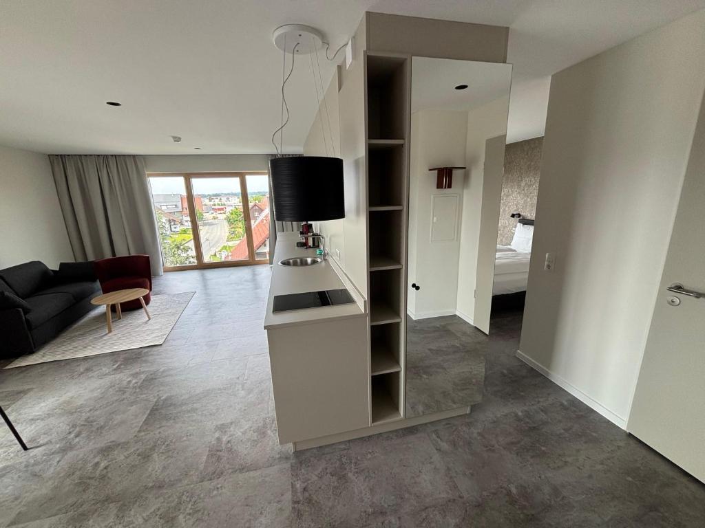 Posezení v ubytování My Flats Studio Apartements - klimatisiert durch Tiefengeothermie - nahe Ravensburger Spieleland und Friedrichshafen