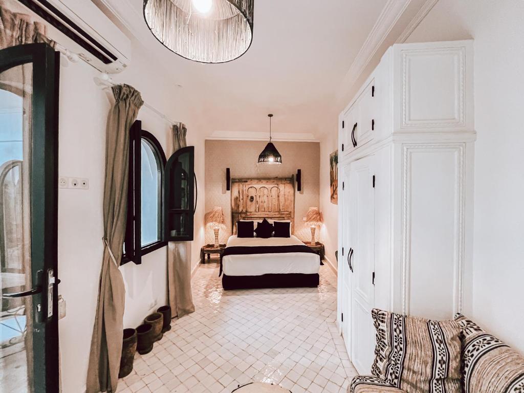 Postel nebo postele na pokoji v ubytování Riad Al Rimal & Spa