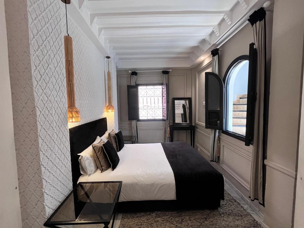 Postel nebo postele na pokoji v ubytování Riad Al Rimal & Spa