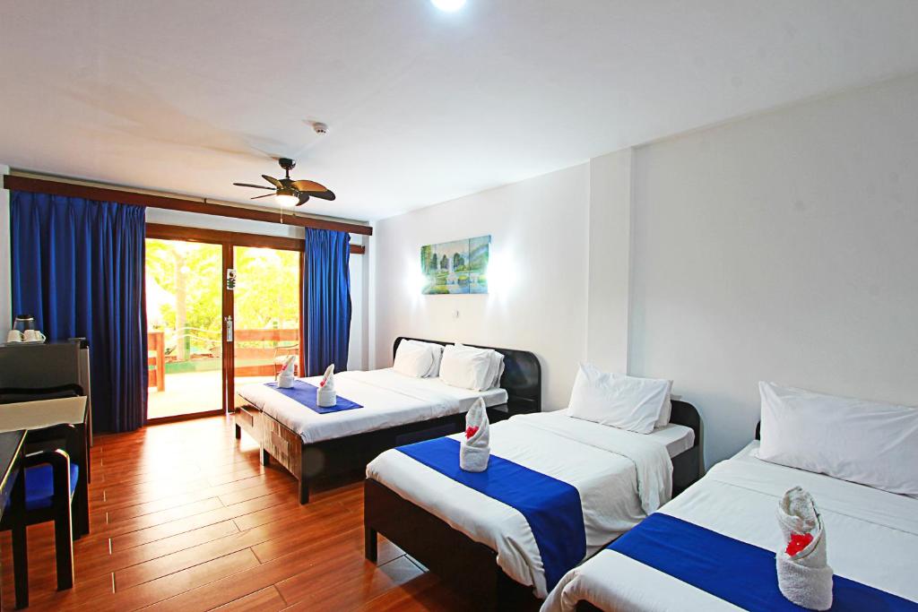 Postel nebo postele na pokoji v ubytování Harmony Hotel