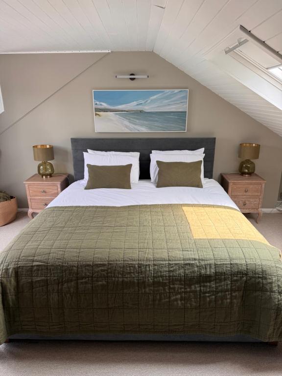 a bedroom with a large bed in a attic at Saviours View in Dartmouth