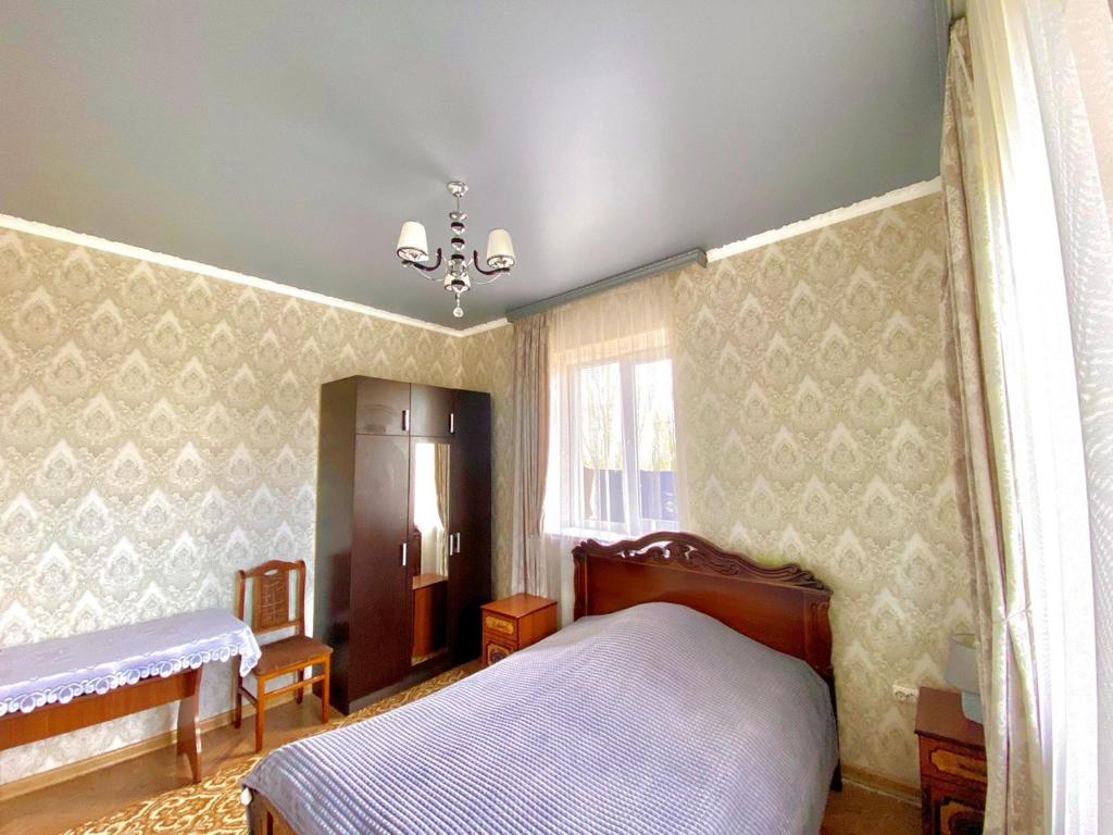 Postel nebo postele na pokoji v ubytování Serik & Geora Guesthouse