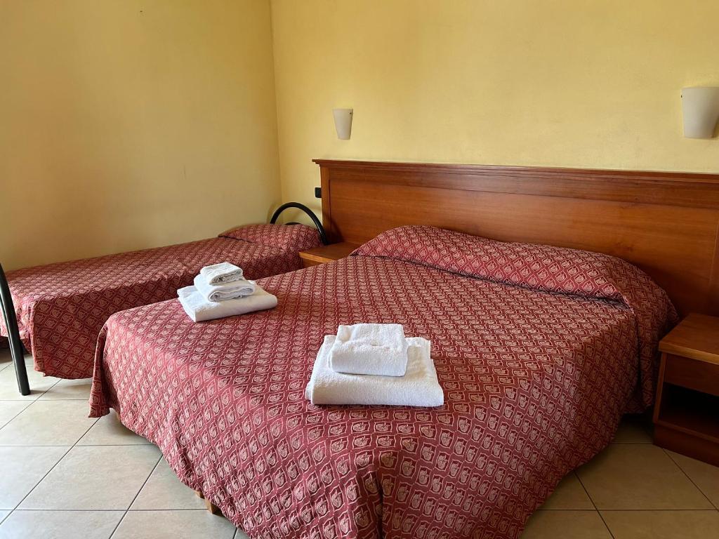 Postel nebo postele na pokoji v ubytování Costa Doro - Hotel