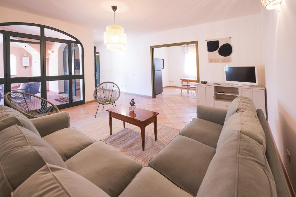 a living room with a couch and a table at House Levante 28 APT 1 in Pula