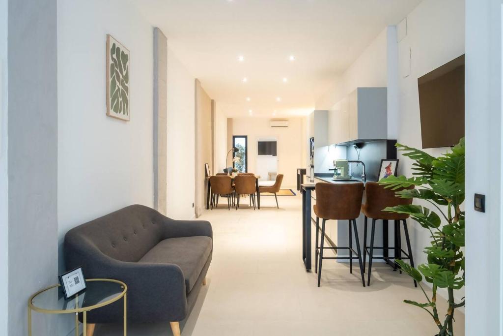 a living room with a couch and a table at Apt new Mestalla | jacuzzi | billar | ping pong in Valencia