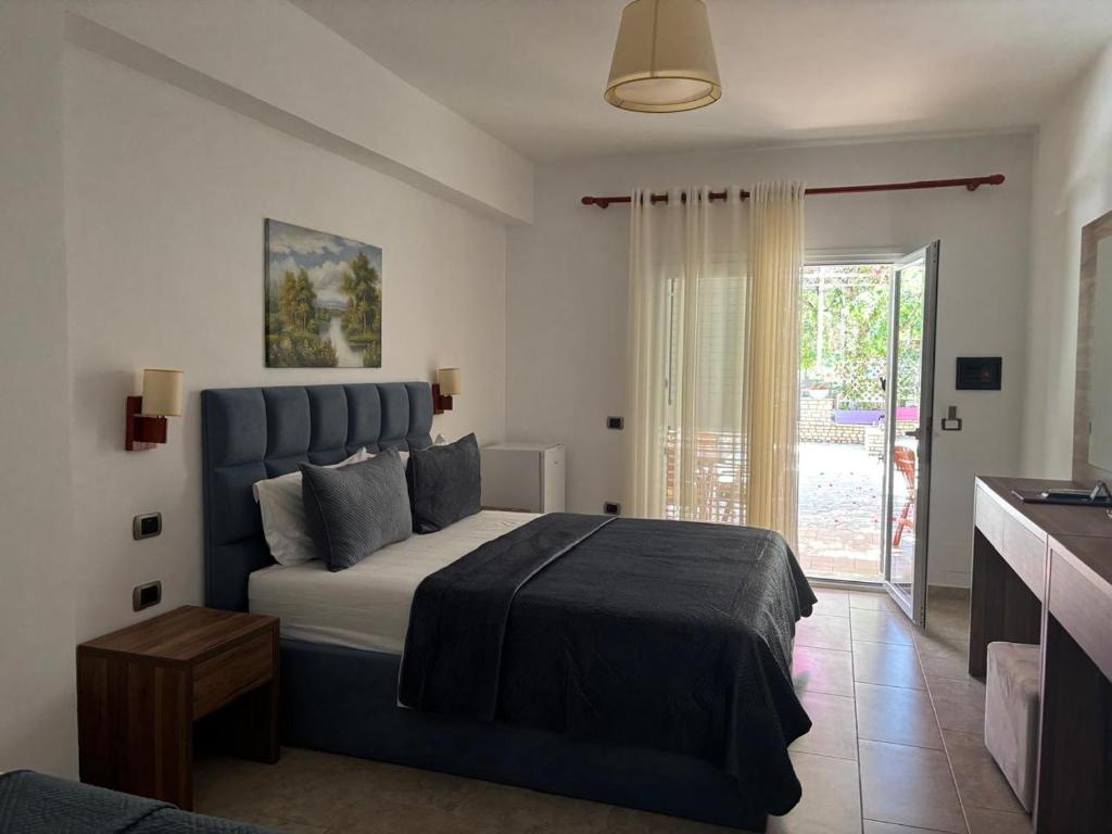 Postel nebo postele na pokoji v ubytování Grand Resort by Greccia Dhermi Prime