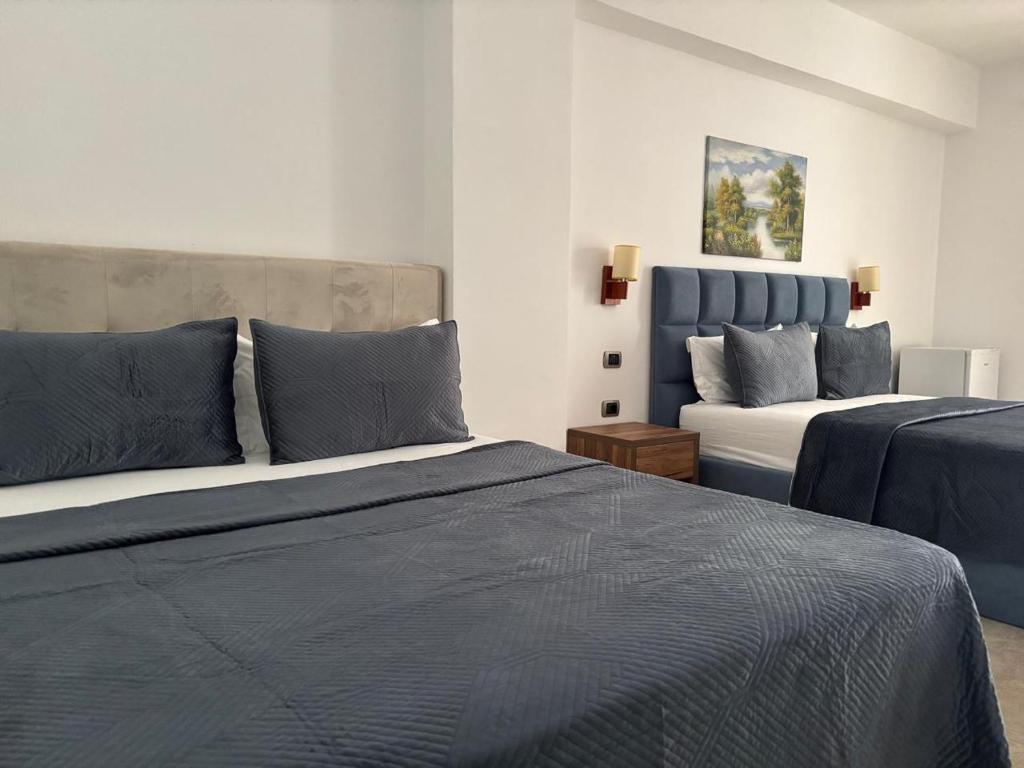Postel nebo postele na pokoji v ubytování Grand Resort by Greccia Dhermi Prime