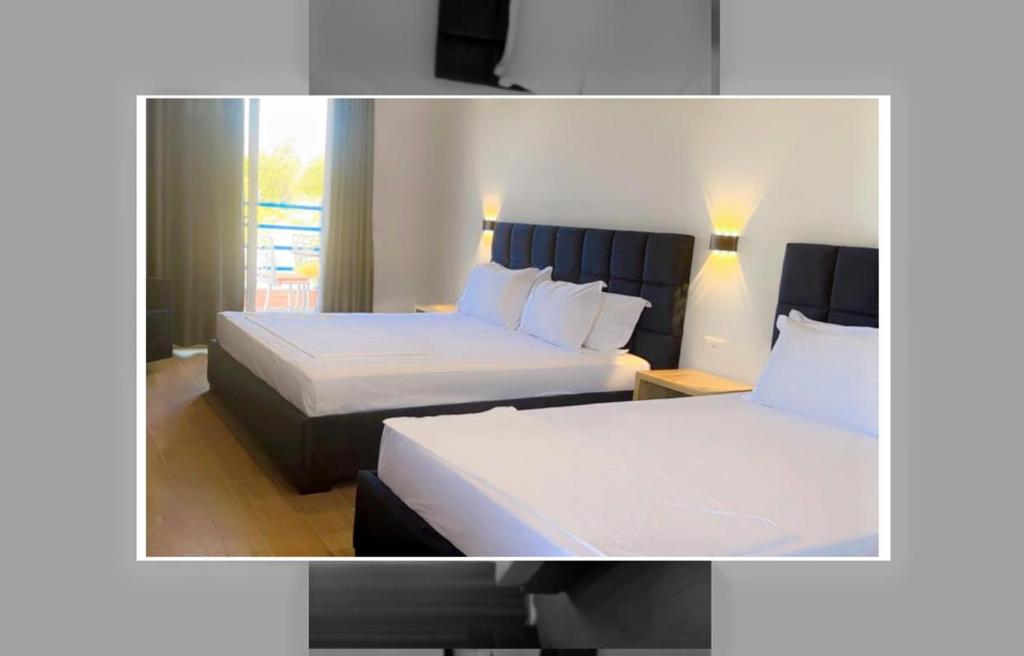 Postel nebo postele na pokoji v ubytování Grand Resort by Greccia Dhermi Prime