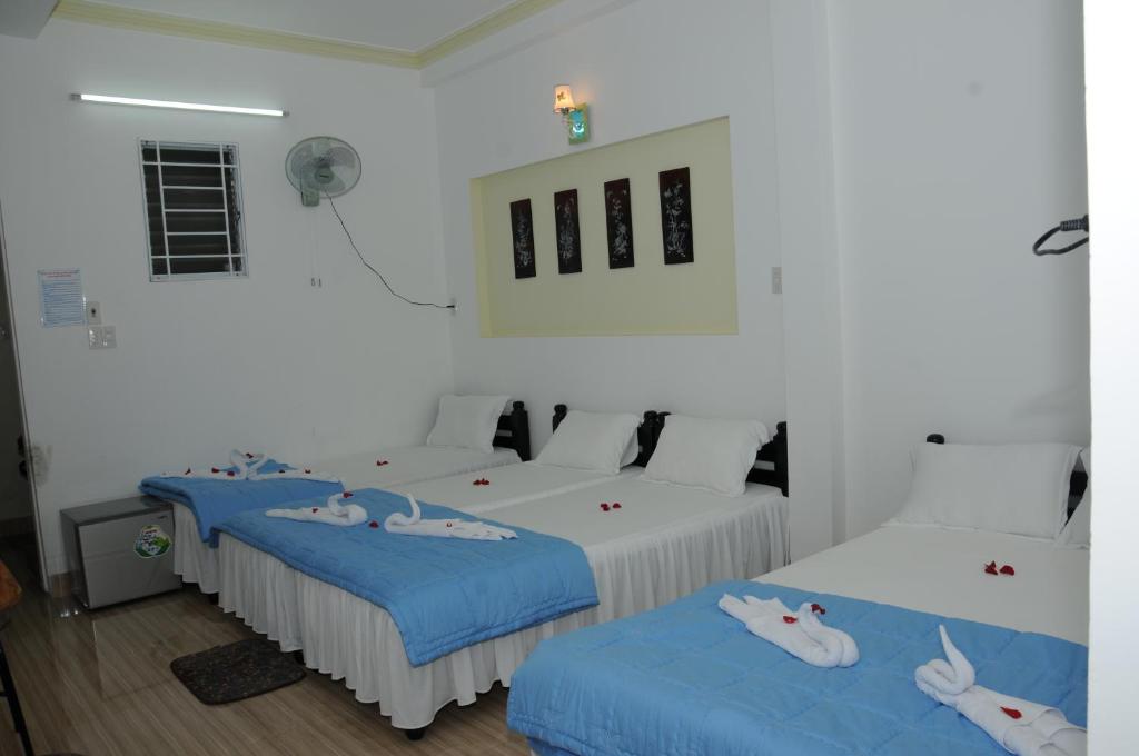 Postel nebo postele na pokoji v ubytování Bien Khoi Mini Hotel