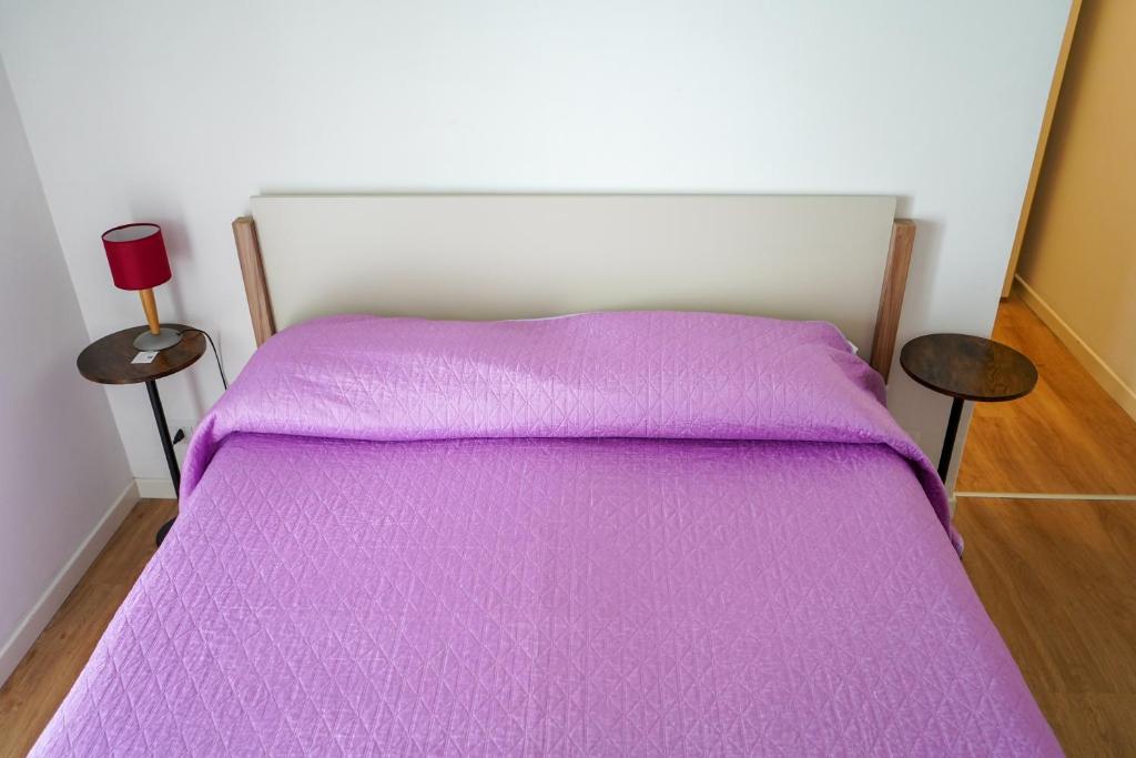 A bed or beds in a room at B&B La Dimora di Rosa