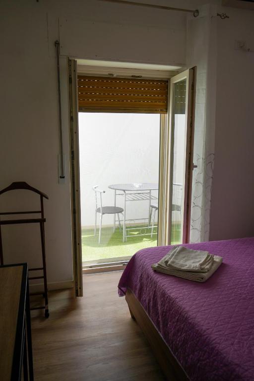 A bed or beds in a room at B&B La Dimora di Rosa