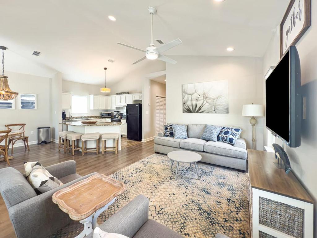 a living room with a couch and a table at Seagrove, 2 Bd , Sleeps 8, Stillwater 30A, Walk to Beach ,Pool in Santa Rosa Beach