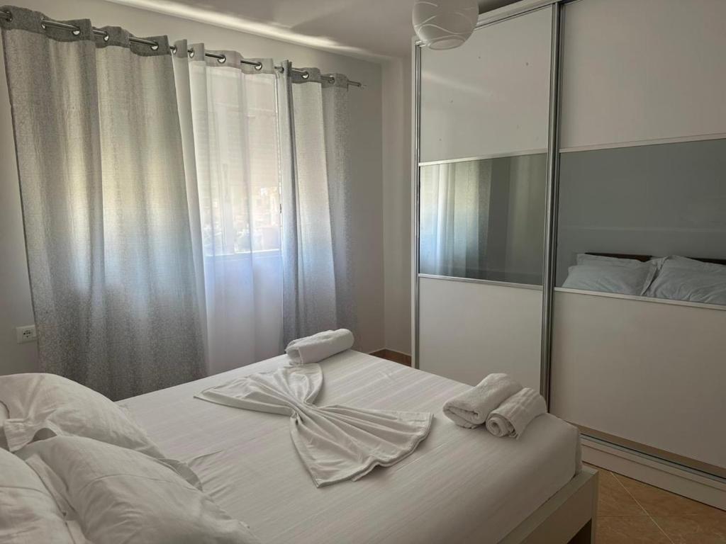 Postel nebo postele na pokoji v ubytování Dion apartamen