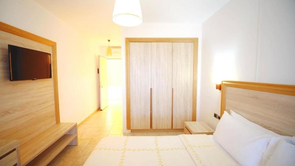 Postel nebo postele na pokoji v ubytování Grand Resort by Greccia Dhermi Prime