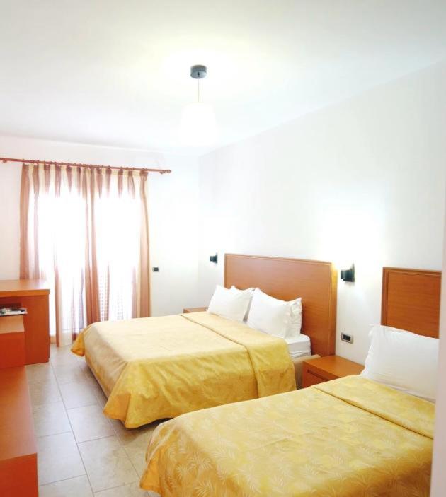 Postel nebo postele na pokoji v ubytování Grand Resort by Greccia Dhermi Prime