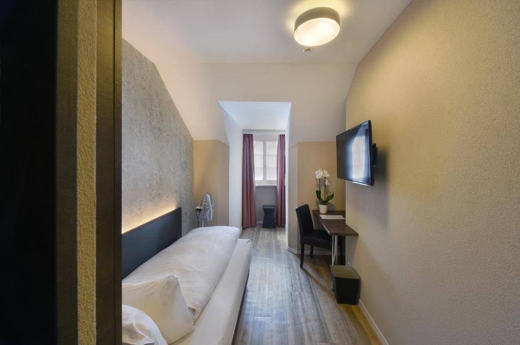 TV a/nebo společenská místnost v ubytování Altstadt Hotel Krone Luzern