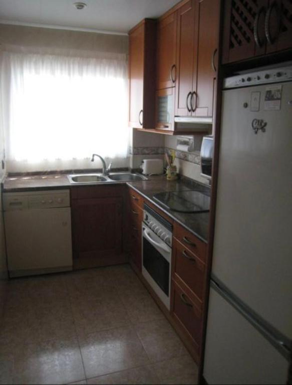 Kuchyň nebo kuchyňský kout v ubytování Apartamento frente al mar