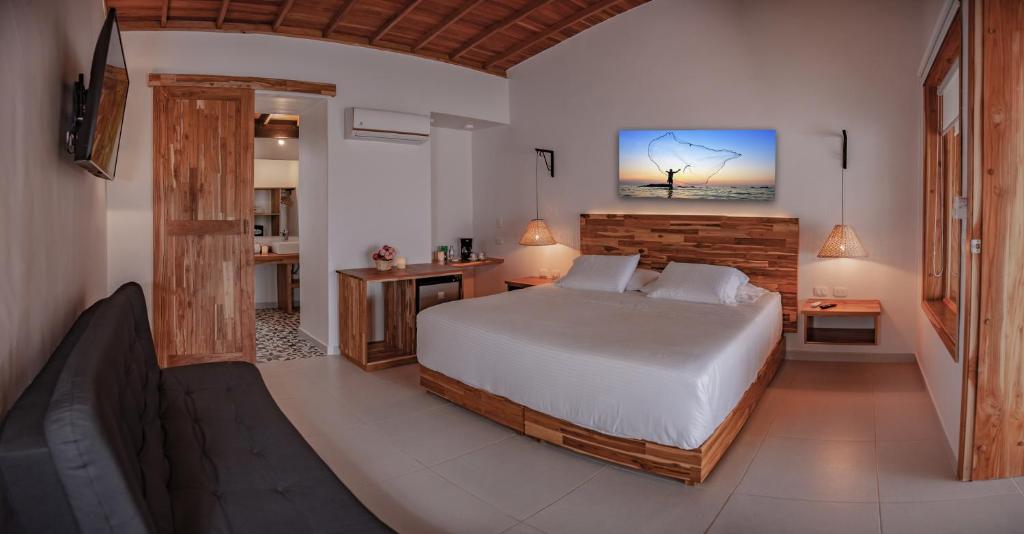 Postel nebo postele na pokoji v ubytování Hotel Punta Faro