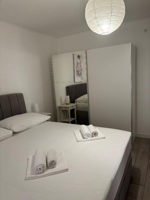 Posteľ alebo postele v izbe v ubytovaní Apartments Sini