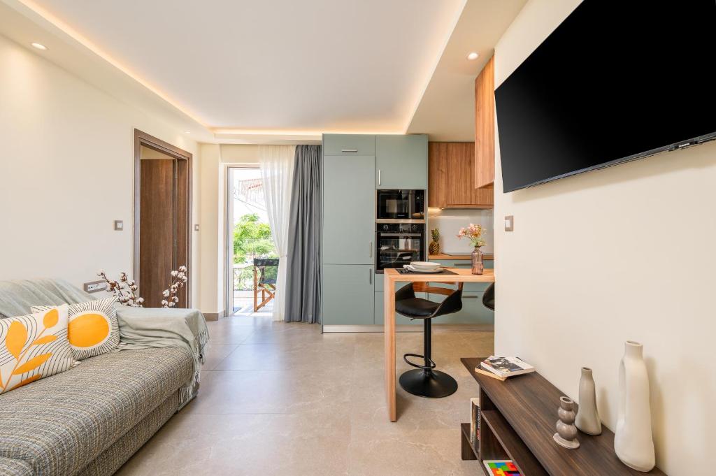 a living room with a couch and a table at Diamante Del Mar Thalia and Erato in Kos