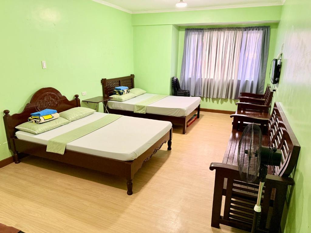 Postel nebo postele na pokoji v ubytování Albergo Hotel - Studio Condo Unit - Baguio Transient