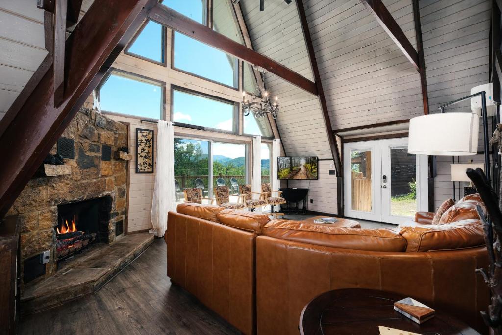 a living room with a couch and a fireplace at Amazing Grace Where Peace Finds You in Pigeon Forge