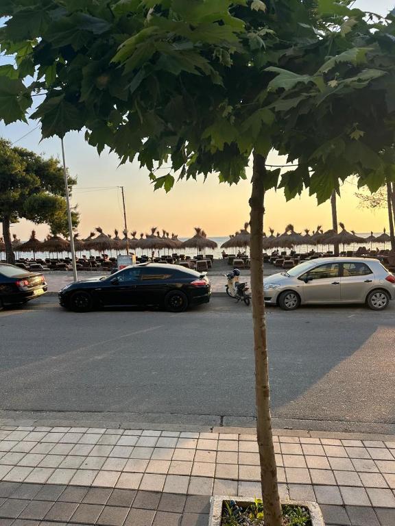 a group of cars parked in a parking lot at Iris apartaments in Sakës