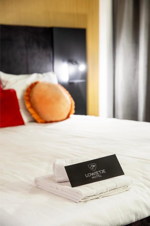 Postel nebo postele na pokoji v ubytování Hotel Lowietje Lisse - Keukenhof