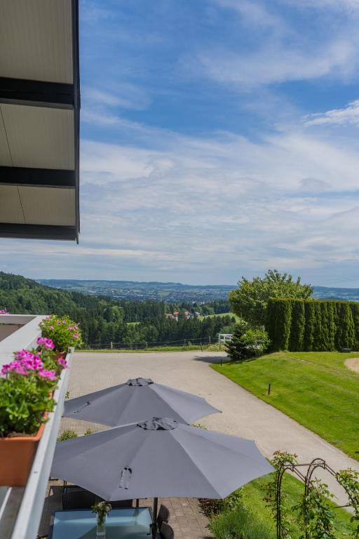 an umbrella sitting on top of a patio at Gut Buchenhof in Buchenberg