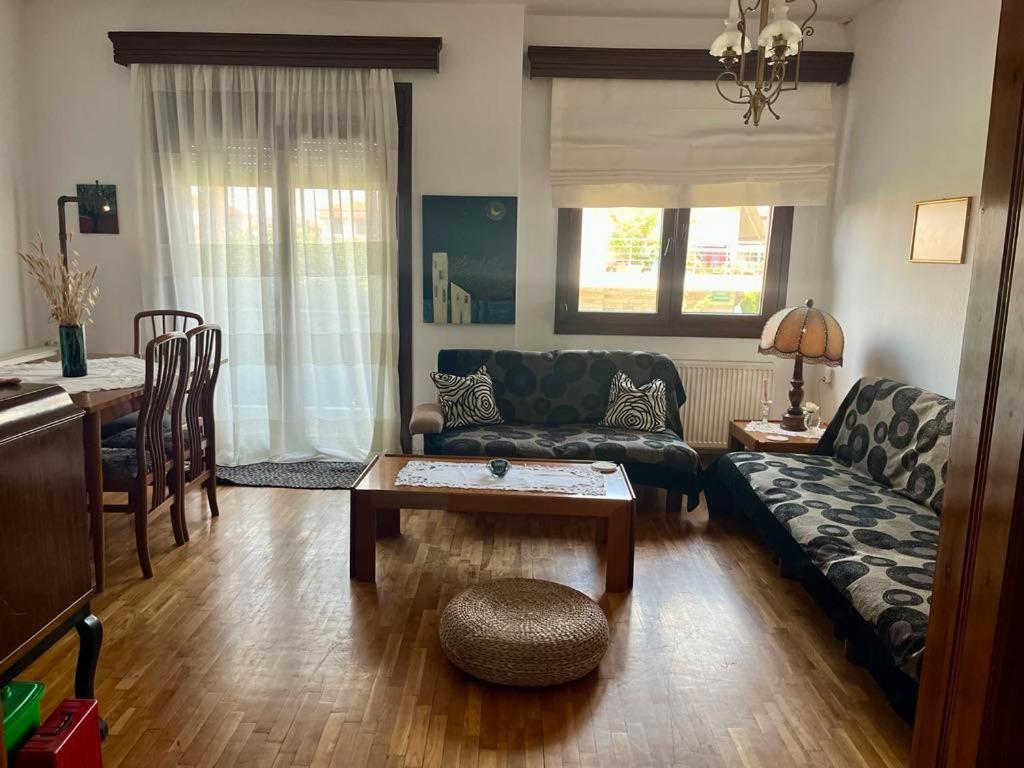 a living room with a couch and a table at Second Home Ierissos in Ierissos