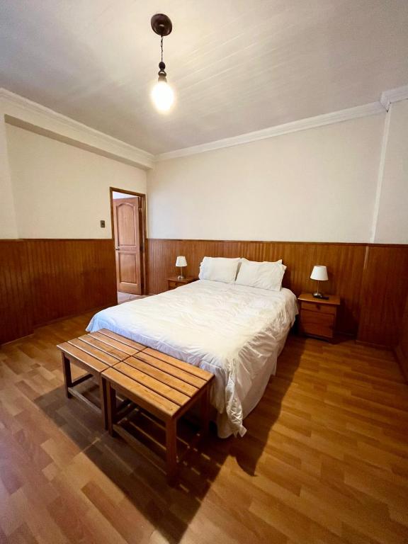 Postel nebo postele na pokoji v ubytování CHALET CHAPITAL Punta Arenas