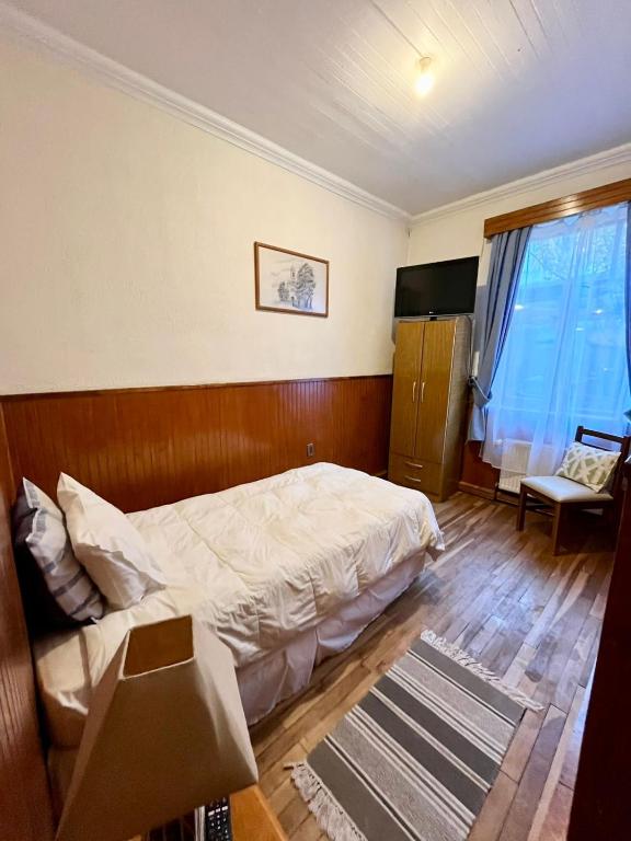 Postel nebo postele na pokoji v ubytování CHALET CHAPITAL Punta Arenas