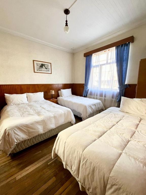 Postel nebo postele na pokoji v ubytování CHALET CHAPITAL Punta Arenas