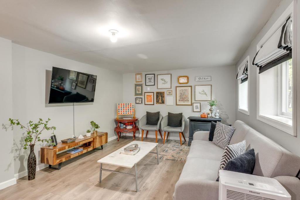 a living room with a couch and a table at Game Room and Deck Family Home in Tobyhanna! in Tobyhanna