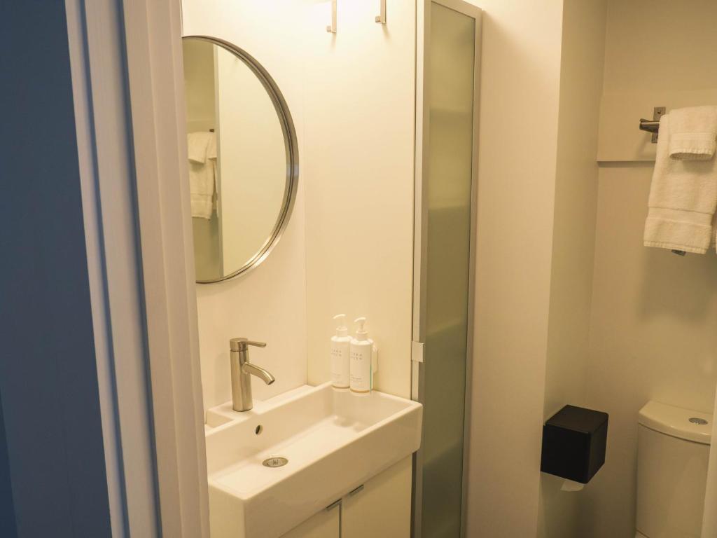 a bathroom with a sink and a mirror at Stones Throw in York Beach