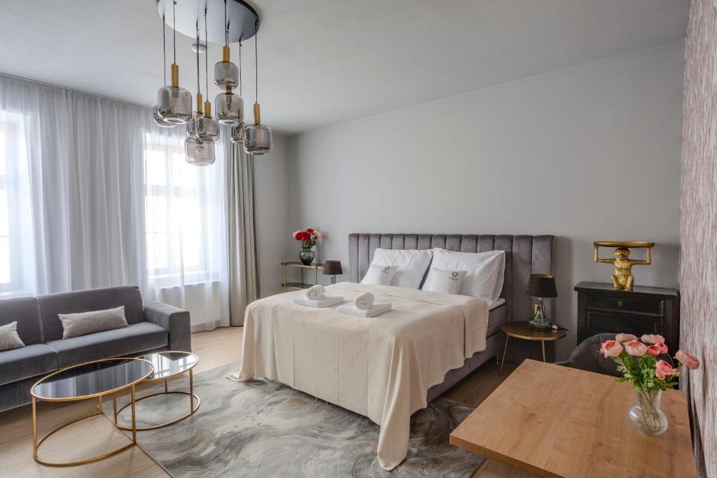 Postel nebo postele na pokoji v ubytování Apartmány U Devíti Lvů