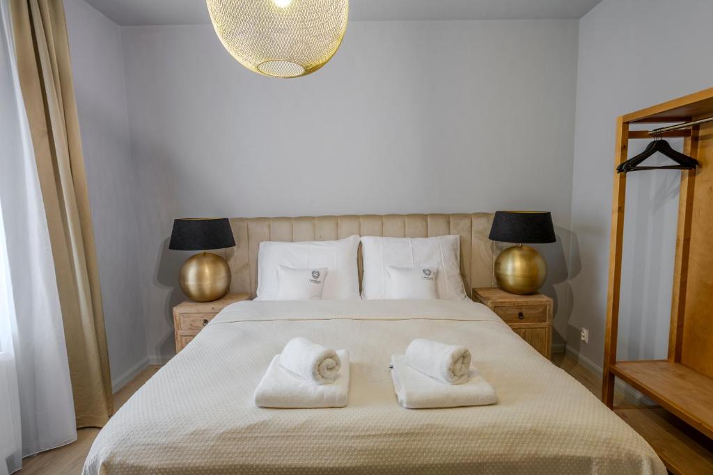 Postel nebo postele na pokoji v ubytování Apartmány U Devíti Lvů