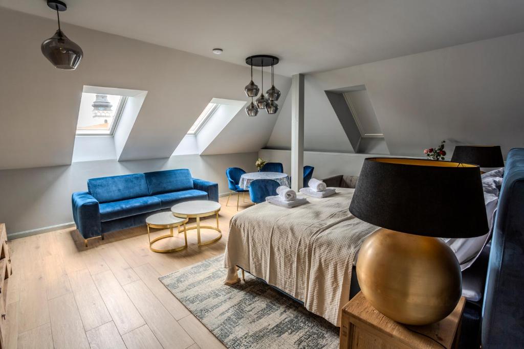 Postel nebo postele na pokoji v ubytování Apartmány U Devíti Lvů