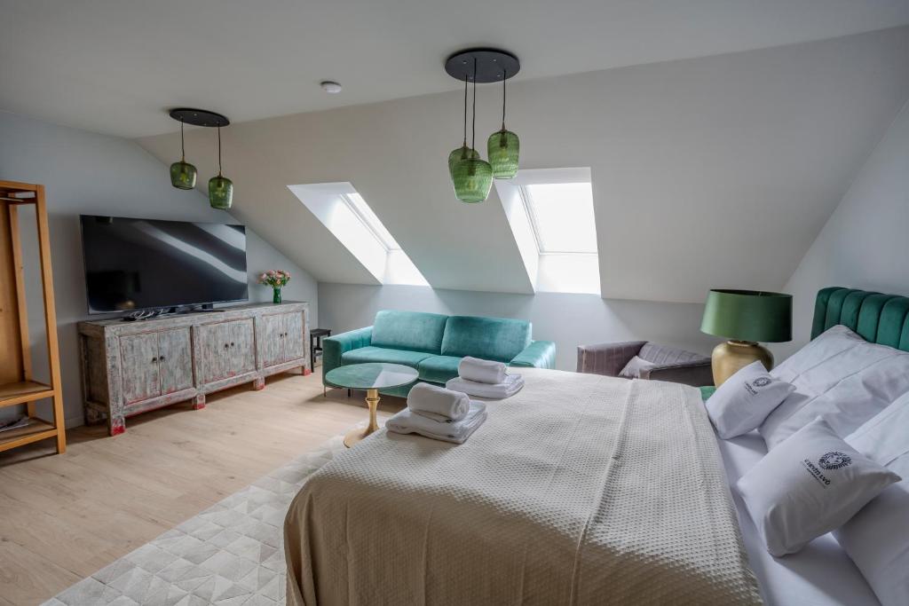 Postel nebo postele na pokoji v ubytování Apartmány U Devíti Lvů